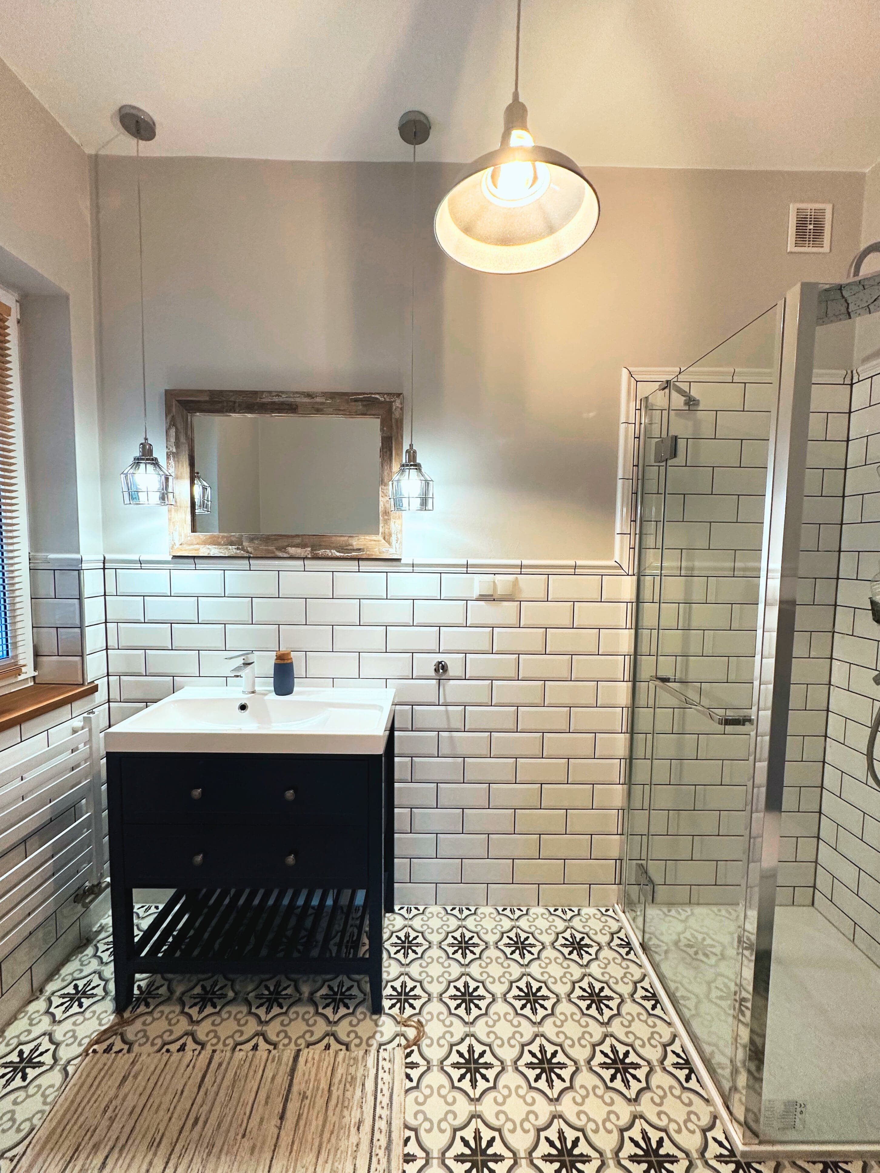 Modern bathroom with white tiles and shower